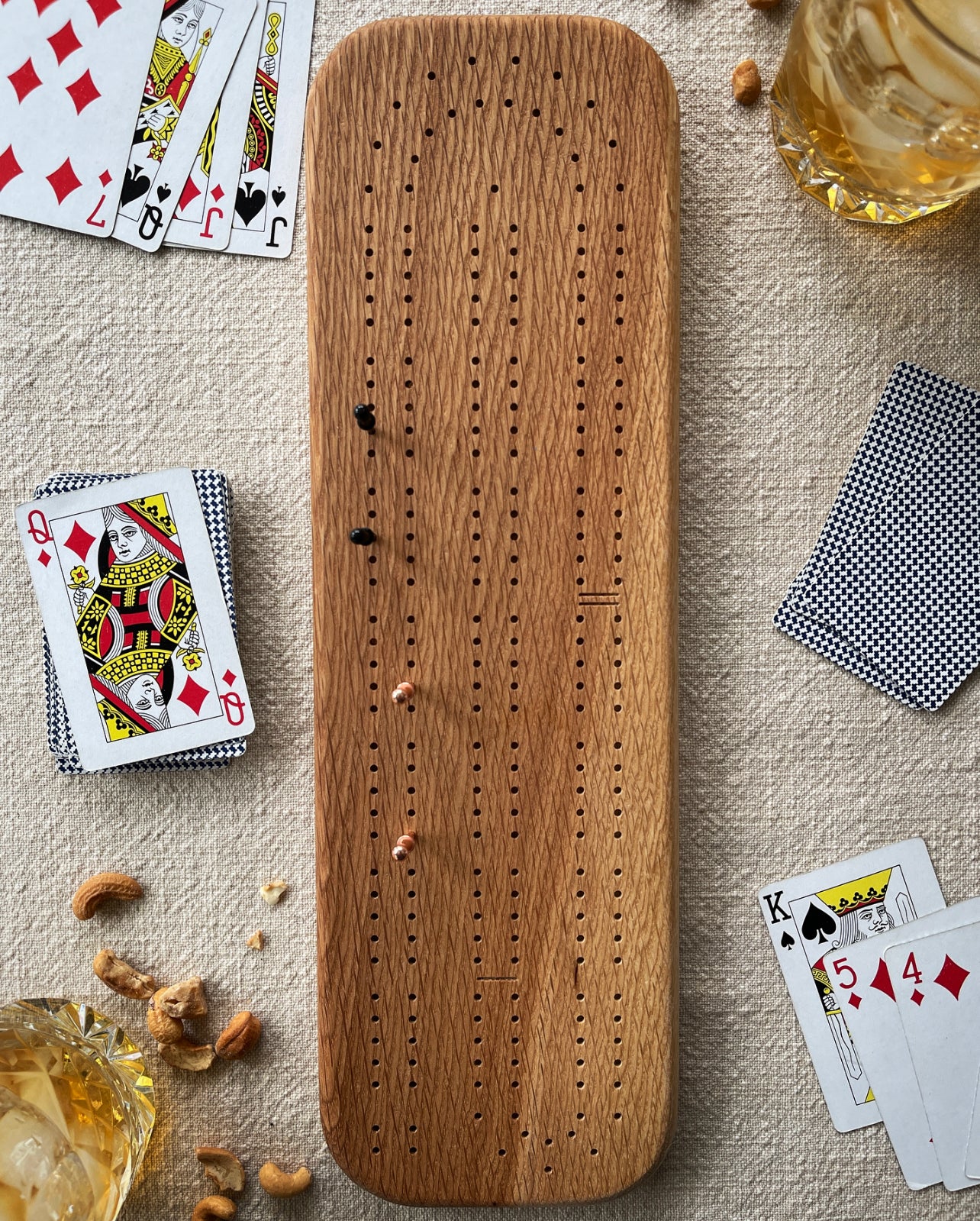 Solid wood cribbage board made from white oak.