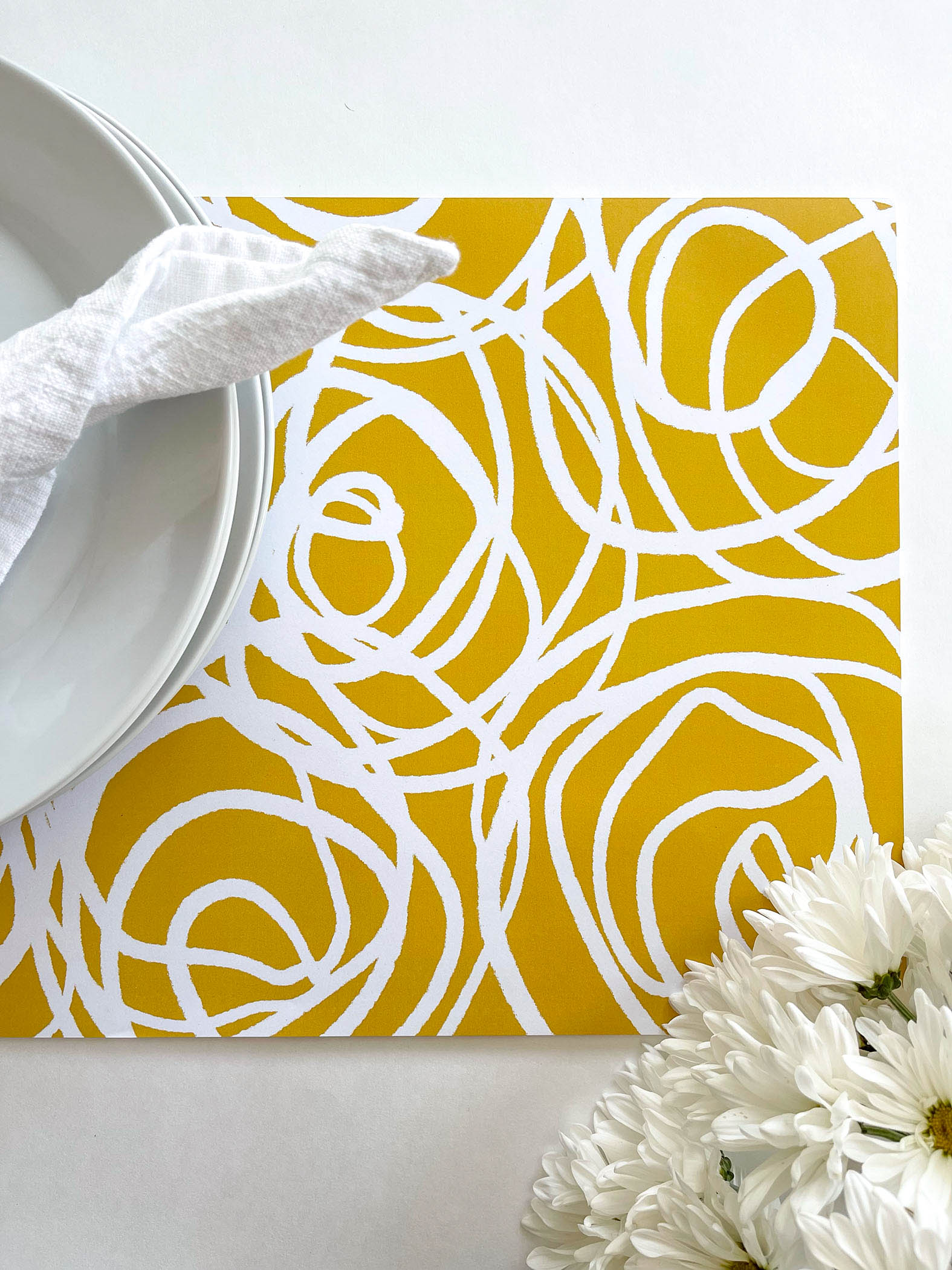 Swirl Paper Placemats are a bright and fun way to dress up any table.